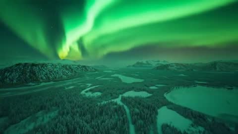 Mesmerizing Northern Lights Glowing Over Snow-Covered Tundra