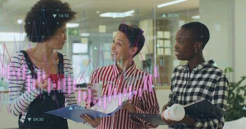 Diverse Team Analyzing Data Charts in Open Workspace