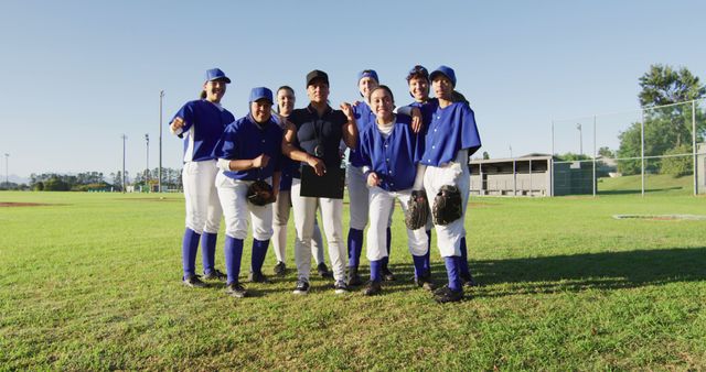 Smiling Youth Baseball Team with Coach on Field - Download Free Stock Images Pikwizard.com