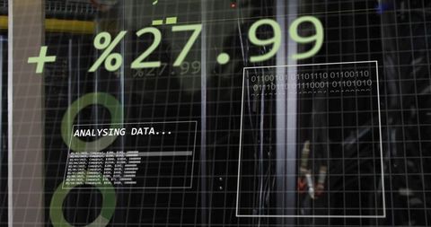Augmented data overlay showing live analytics and binary readout on datacenter glass panel