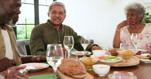 Senior Friends Enjoying Retirement Celebration at Home