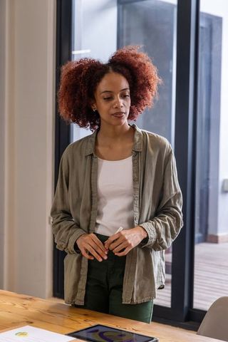 Businesswoman Engaging with Tablet in Modern Office