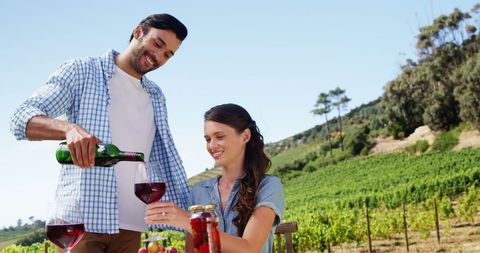 Couple Enjoying Wine Tasting at Sunny Vineyard - Download Free Stock Images Pikwizard.com