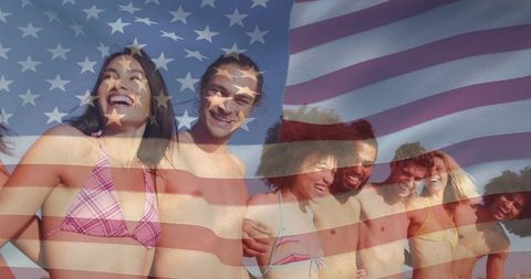Friends celebrating summer at lakeside beach wearing swimwear with american flag overlay