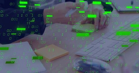 Hands clicking keyboard with green binary overlay conveying cybersecurity and data protection