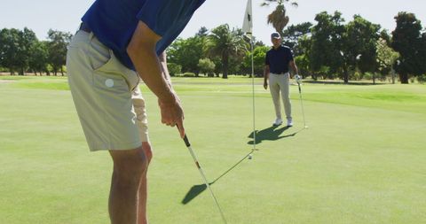 Senior Men Playing Golf on a Sunny Day with Elegant Style - Download Free Stock Images Pikwizard.com