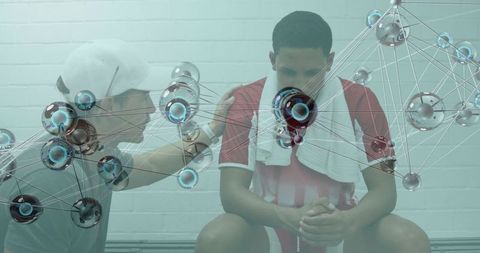 Coach consoling young athlete on locker-room bench with futuristic network overlay