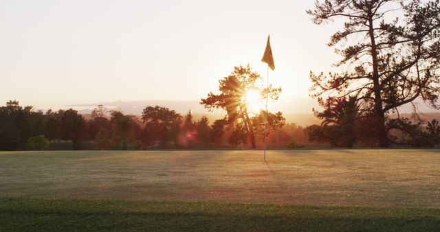 Image of golf field in summer at sunset. landscape, summer, sport and playing golf concept.