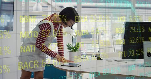 Businesswoman Analyzing Financial Digital Data in Modern Office
