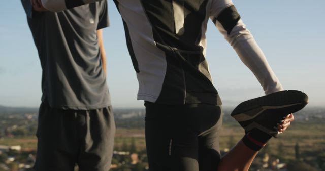 People Exercising Outdoors Stretching Legs During Sunset - Download Free Stock Images Pikwizard.com