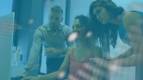 Diverse Team Analyzing Online Data in Modern Office