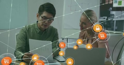 Business team analyzing documents with cybersecurity and e-commerce network overlay