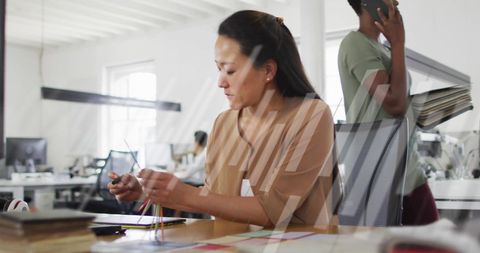 Businesswoman Navigating Data in Modern Office Setting