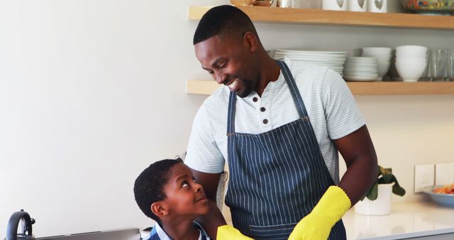 Happy African American Father and Son Washing Dishes in Modern Kitchen - Download Free Stock Images Pikwizard.com