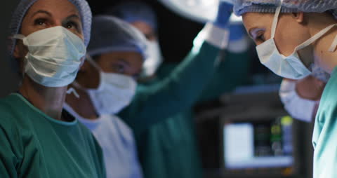 Surgeons Focused in Operating Room Amid Surgery Procedure
