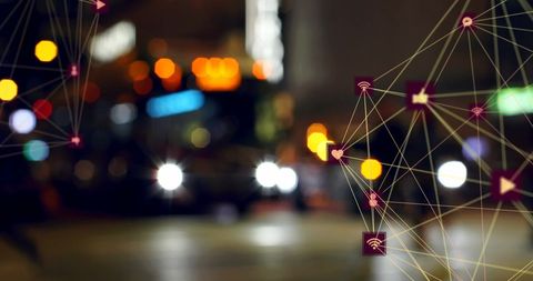 Digital Network Overlay on Blurred Urban Night Scene