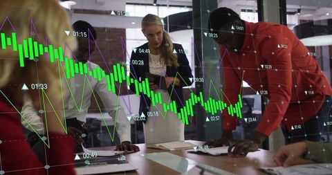 Team Analyzing Data Trends in Modern Office Meeting