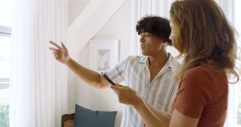 Real estate agent discussing home features with potential buyer