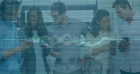 Diverse Team Analyzing Financial Data Trends with Technology