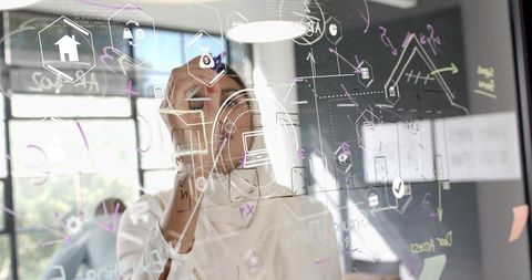 Innovative Businesswoman Anotating Technology Concepts