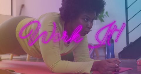 Focused African American Woman Practicing Plank Exercise in Home Fitness Routine