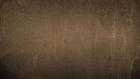 Aged brown paper grunge texture with scratches, creases and dark vignette