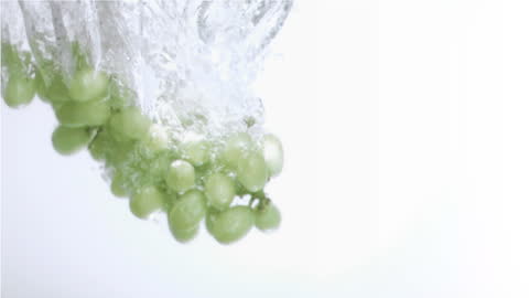 Green Grapes Splashing in Slow Motion