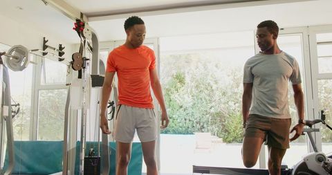 African American Men Training in Home Gym for Strength and Fitness
