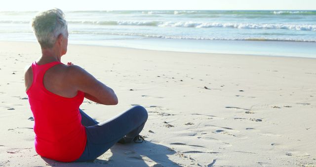 Senior Woman Meditating on Beach at Sunrise - Download Free Stock Images Pikwizard.com