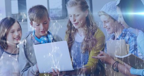Diverse Teen Students Engaging with Laptop and Technology