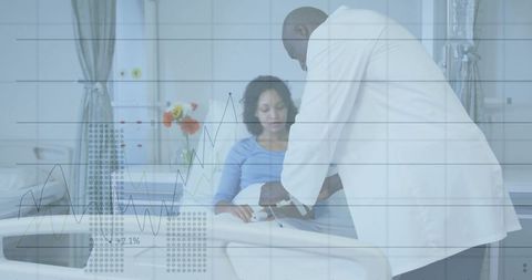 Doctor measuring blood pressure in hospital room