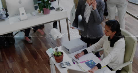 Collaborative Business Meeting with Technology Integration in Modern Workplace