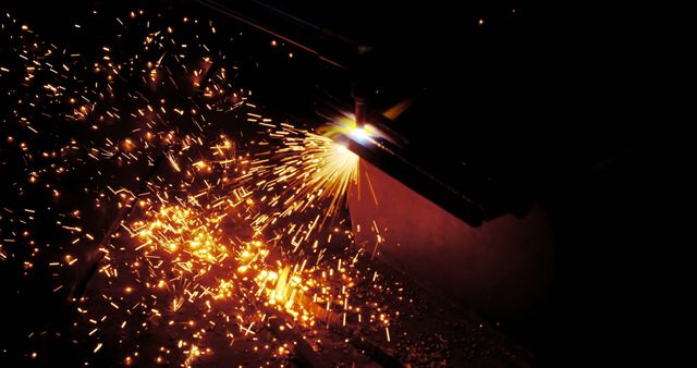 Close-Up of Industrial Welding with Sparks in Dark Workshop - Download Free Stock Photos Pikwizard.com