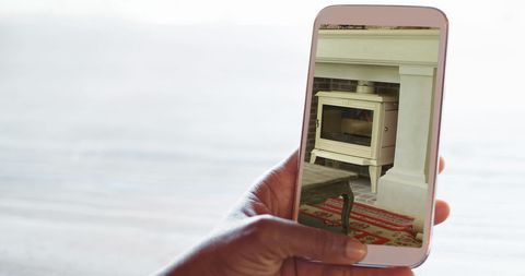 Exploring Fireplace Design on Smartphone Screen - Download Free Stock Images Pikwizard.com