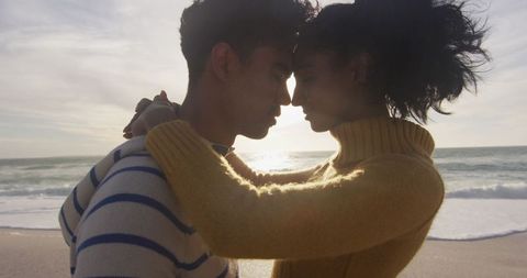 Romantic beach embrace at sunset