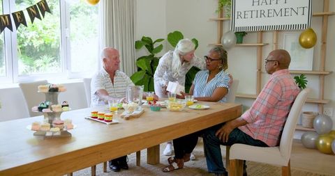Senior Friends Celebrating Retirement with Joy and Laughter