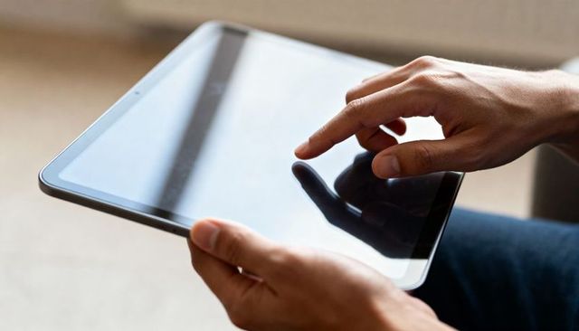 Tapping Tablet Screen Closeup Adult Hands Touching Touchscreen with Window Reflection