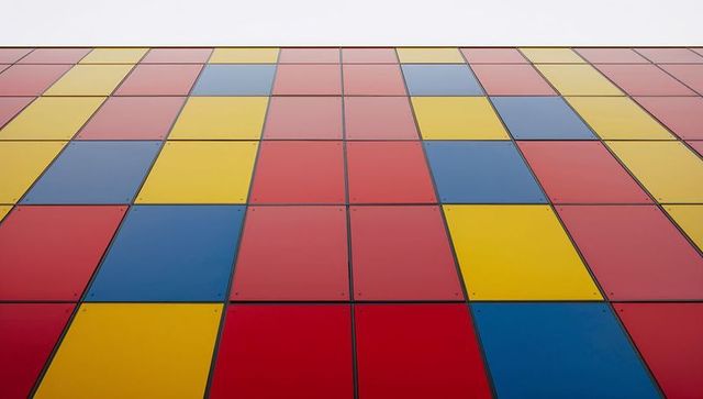 Colorful geometric metal facade of modern building exterior