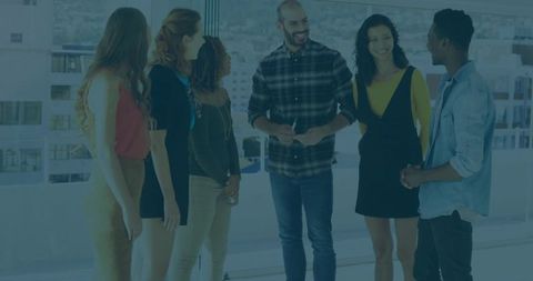 Diverse Team Collaborating in Modern Office with City View