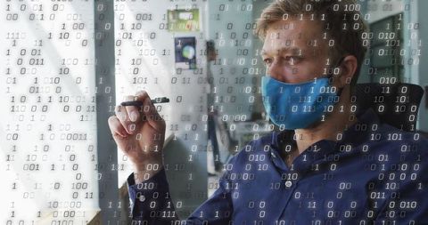 Masked Professional Innovator Coordinating on Transparent Screen with Binary Overlay
