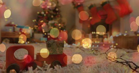 Enchanted Christmas Living Room with Toy Truck and Bokeh Lights - Download Free Stock Images Pikwizard.com