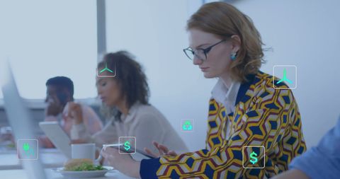 Businesswoman Using Tablet with Digital Icons Overlay in Office