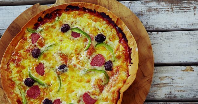 Delicious Pepperoni and Olive Pizza on Rustic Wooden Table - Download Free Stock Images Pikwizard.com