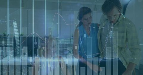 Professionals Analyzing Digital Data in Modern Corporate Office