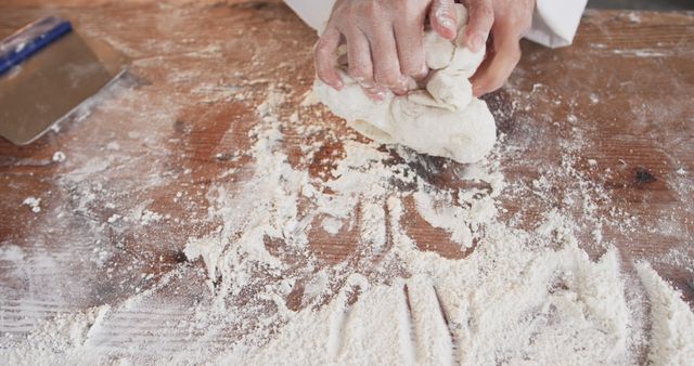 Baker Kneading Dough on Floured Wooden Surface - Download Free Stock Images Pikwizard.com
