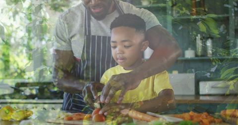 Father and Son Cooking Together with Nature Overlay