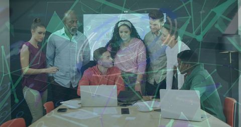 Diverse Team Discussing Technology Solutions in Modern Office