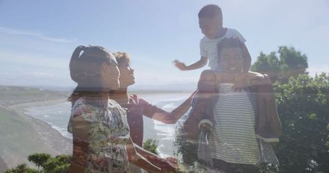 Family walking along coastal bluff path enjoying scenic ocean view