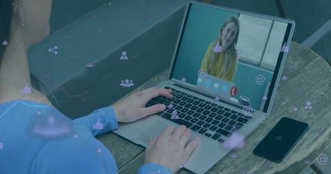 Remote work communication over video call on laptop
