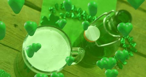 Emerald st patrick's celebration foamy green beer mug with swing-top bottle and floating hearts